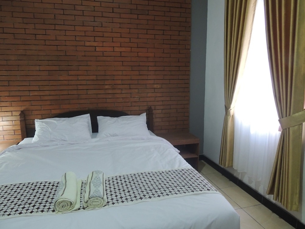 Imagen de la habitación del Casa de Huéspedes Omah Mardi Syariah by Ndalem Beong. Foto 5