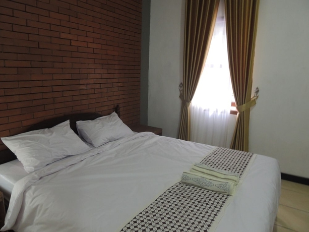 Imagen de la habitación del Casa de Huéspedes Omah Mardi Syariah by Ndalem Beong. Foto 6