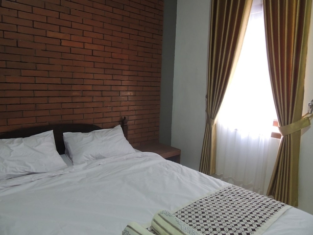 Imagen de la habitación del Casa de Huéspedes Omah Mardi Syariah by Ndalem Beong. Foto 7