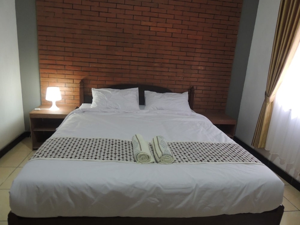 Imagen de la habitación del Casa de Huéspedes Omah Mardi Syariah by Ndalem Beong. Foto 8
