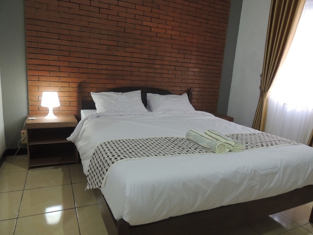 Imagen de la habitación del Casa de Huéspedes Omah Mardi Syariah by Ndalem Beong. Foto 10