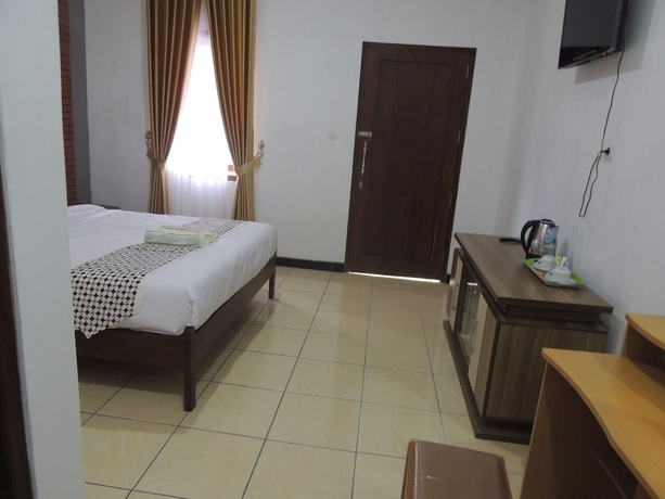 Imagen de la habitación del Casa de Huéspedes Omah Mardi Syariah by Ndalem Beong. Foto 11
