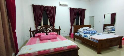 Imagen de la habitación del Casa de Huéspedes Penginapan Pendopo Kasih. Foto 10