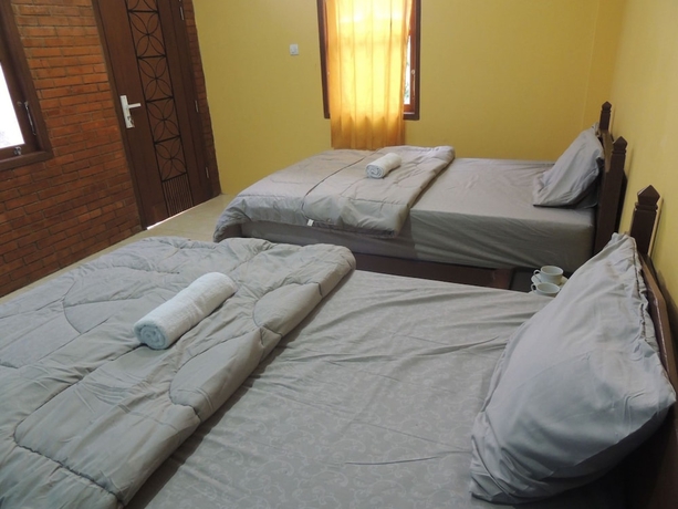 Imagen de la habitación del Casa de Huéspedes Penginapan Wardi Syariah Borobudur by Ndalem Beong. Foto 10