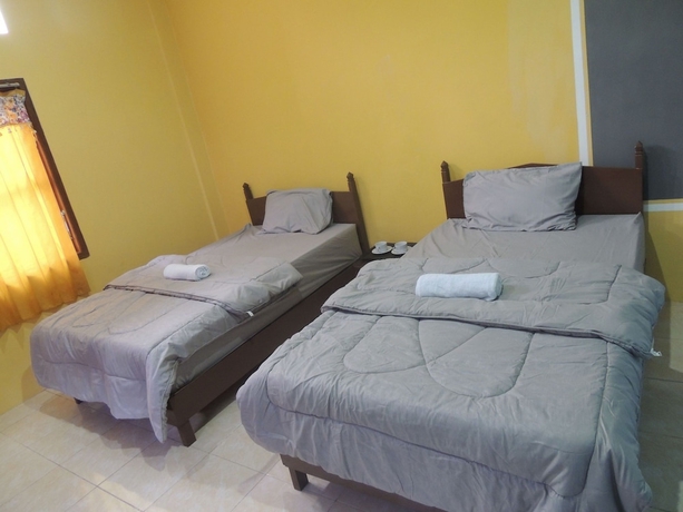 Imagen de la habitación del Casa de Huéspedes Penginapan Wardi Syariah Borobudur by Ndalem Beong. Foto 11