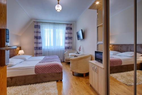 Imagen de la habitación del Casa de Huéspedes Pensjonat Dawidek. Foto 8