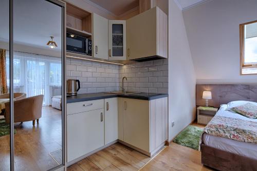 Imagen de la habitación del Casa de Huéspedes Pensjonat Dawidek. Foto 9