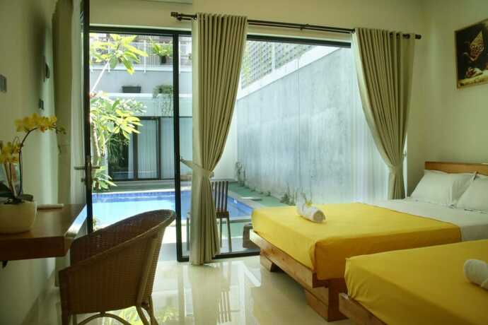 Imagen de la habitación del Casa de Huéspedes Roemah Kenari. Foto 14