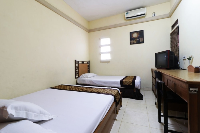 Imagen de la habitación del Casa de Huéspedes Rumah Tawa Guesthouse 1. Foto 8