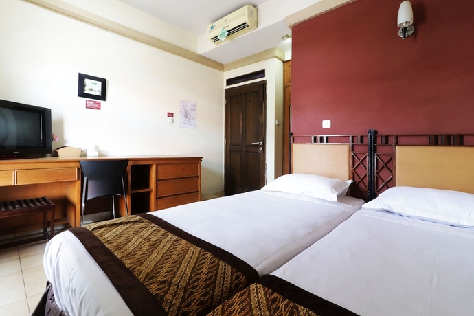 Imagen de la habitación del Casa de Huéspedes Rumah Tawa Guesthouse 1. Foto 10