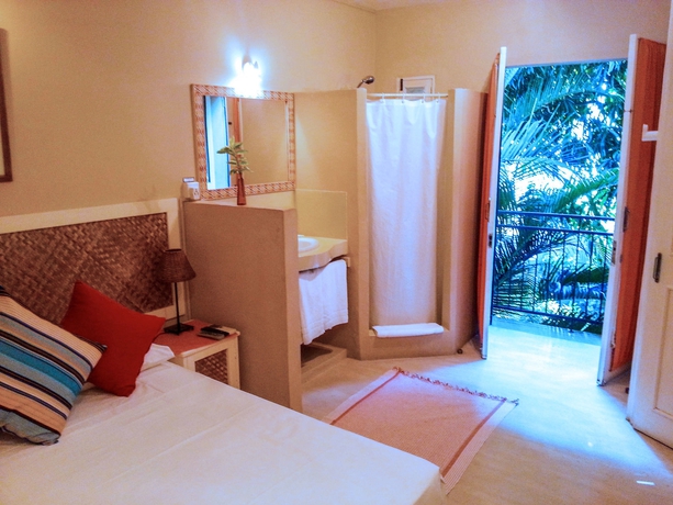 Imagen de la habitación del Casa de Huéspedes Sous Le Badamier. Foto 4