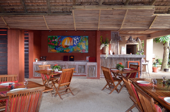 Imagen del bar/restaurante del Casa de Huéspedes Sous Le Badamier. Foto 1