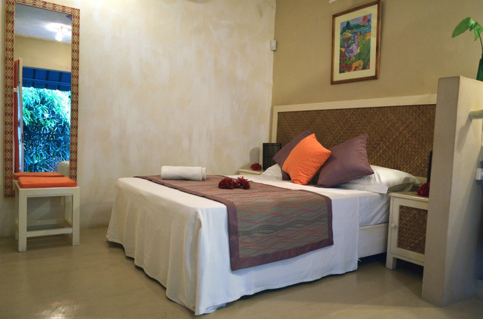 Imagen de la habitación del Casa de Huéspedes Sous Le Badamier. Foto 7