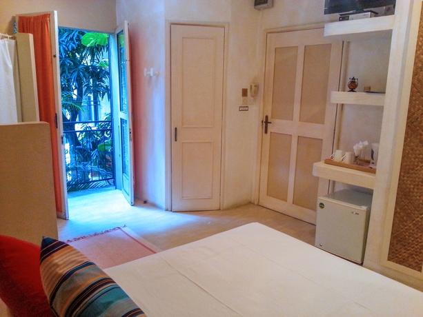 Imagen de la habitación del Casa de Huéspedes Sous Le Badamier. Foto 9