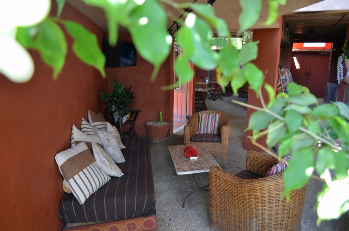 Imagen de los exteriores del Casa de Huéspedes Sous Le Badamier. Foto 11