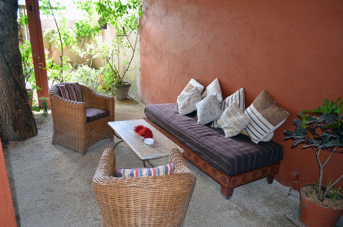 Imagen de los exteriores del Casa de Huéspedes Sous Le Badamier. Foto 12