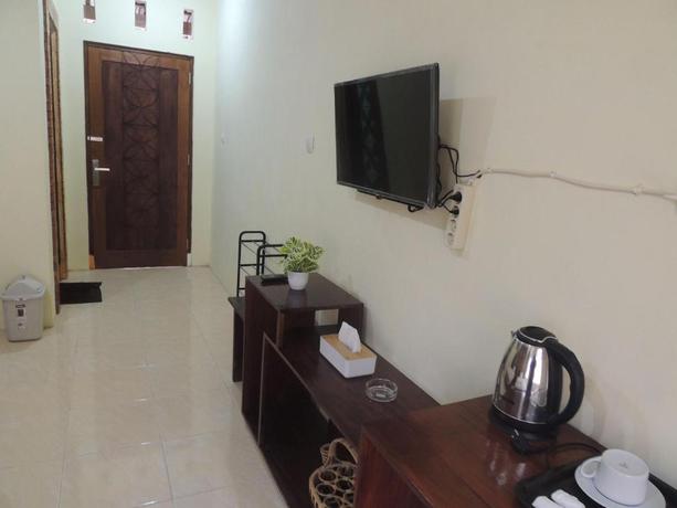 Imagen de los interiores del Casa de Huéspedes Srikayah Syariah by Ndalem Beong. Foto 5