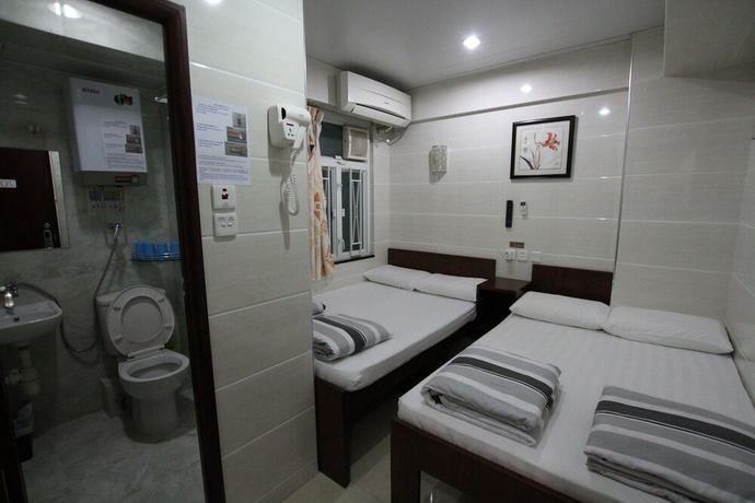 Imagen de la habitación del Casa de Huéspedes Tai Wah Guest House. Foto 2