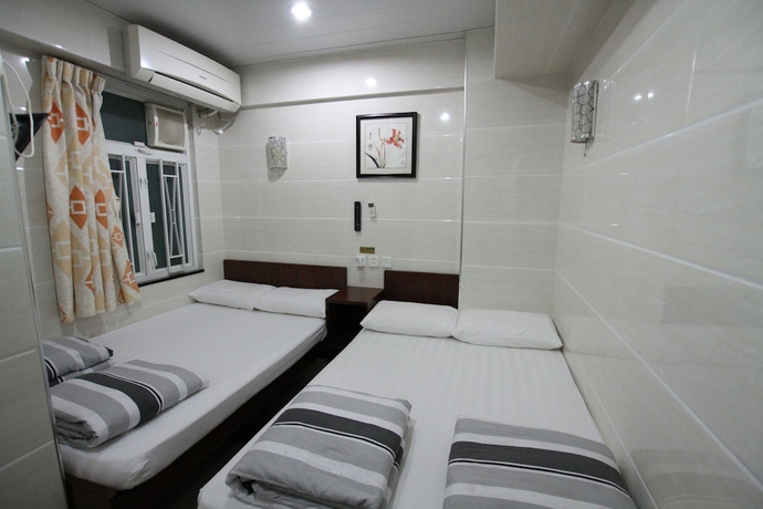 Imagen de la habitación del Casa de Huéspedes Tai Wah Guest House. Foto 3