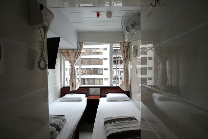 Imagen de la habitación del Casa de Huéspedes Tai Wah Guest House. Foto 5