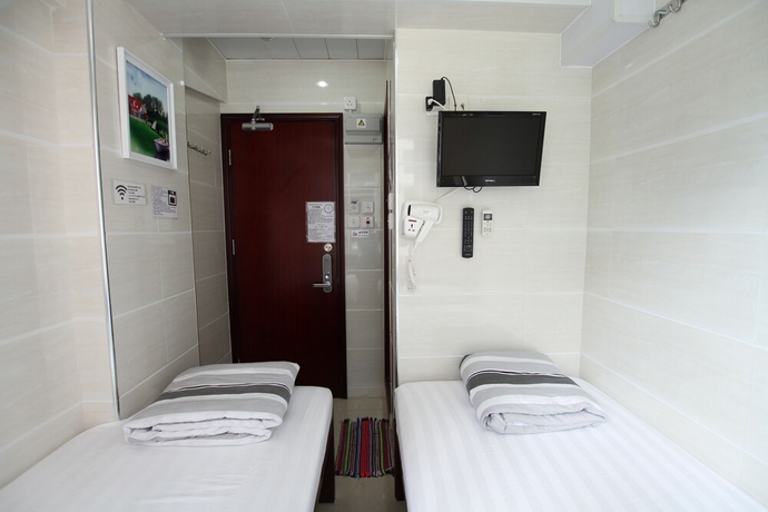 Imagen de la habitación del Casa de Huéspedes Tai Wah Guest House. Foto 6