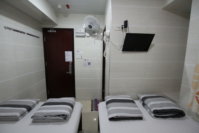 Imagen de la habitación del Casa de Huéspedes Tai Wah Guest House. Foto 7