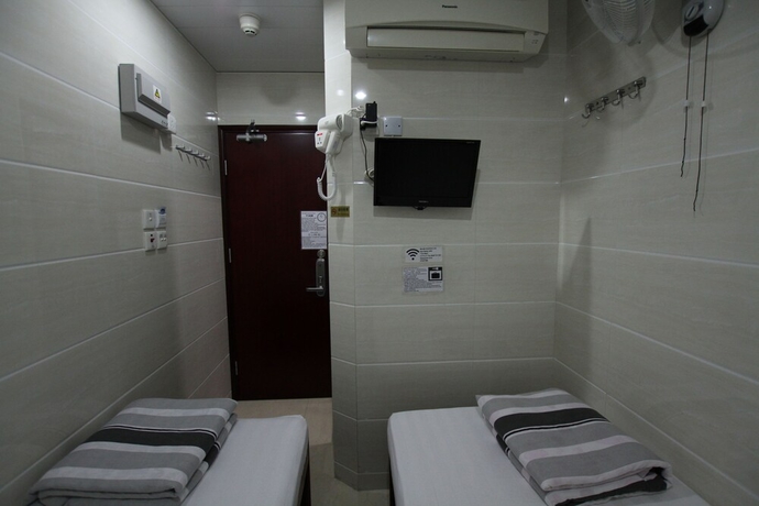 Imagen de la habitación del Casa de Huéspedes Tai Wah Guest House. Foto 8