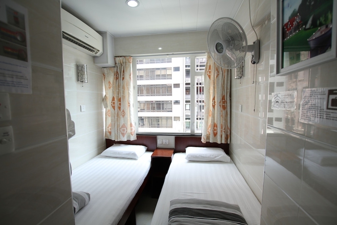 Imagen de la habitación del Casa de Huéspedes Tai Wah Guest House. Foto 9