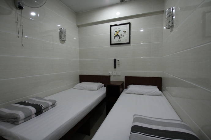 Imagen de la habitación del Casa de Huéspedes Tai Wah Guest House. Foto 10