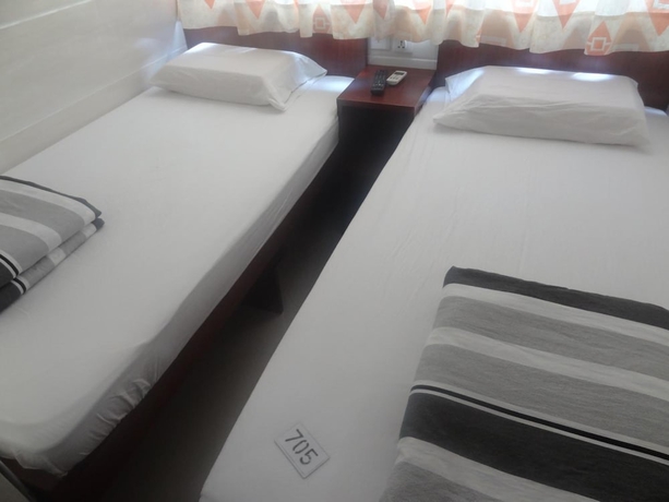 Imagen de la habitación del Casa de Huéspedes Tai Wah Guest House. Foto 11