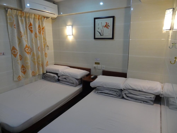Imagen de la habitación del Casa de Huéspedes Tai Wah Guest House. Foto 12