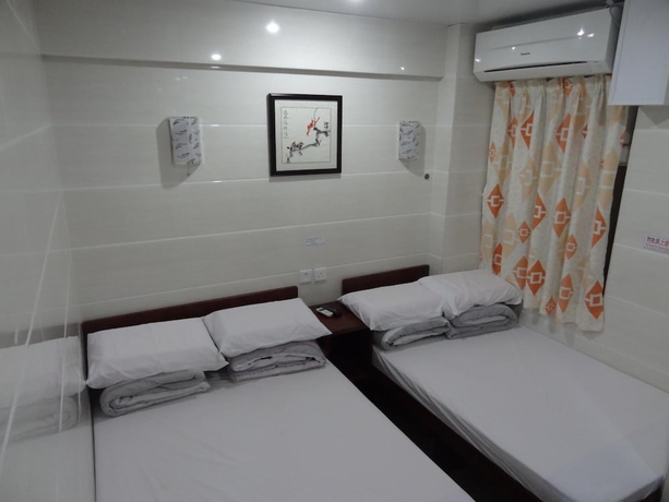 Imagen de la habitación del Casa de Huéspedes Tai Wah Guest House. Foto 14