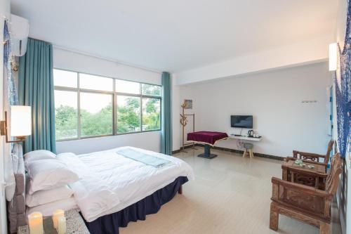 Imagen de la habitación del Casa de Huéspedes Weizhou Yalan. Foto 8