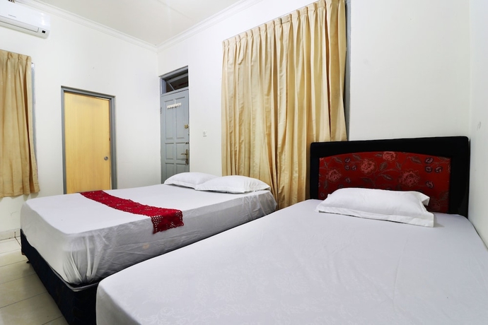 Imagen de la habitación del Casa de Huéspedes Wisma Lamida 2 Syariah. Foto 10