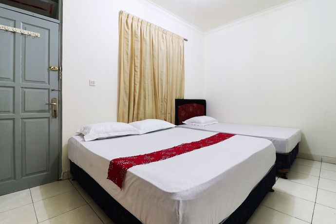 Imagen de la habitación del Casa de Huéspedes Wisma Lamida 2 Syariah. Foto 11