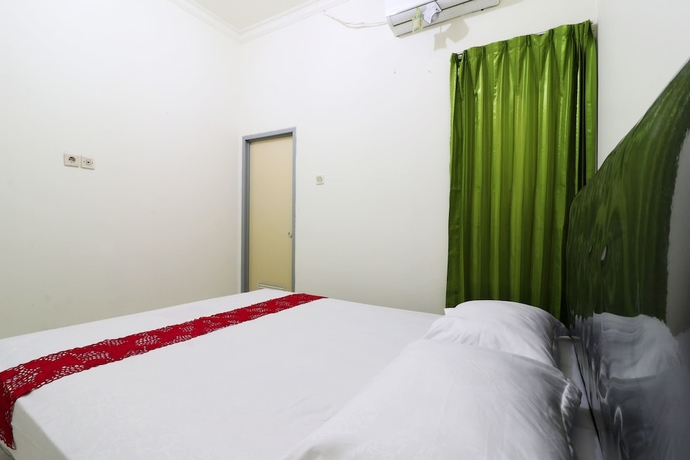 Imagen de la habitación del Casa de Huéspedes Wisma Lamida 2 Syariah. Foto 13