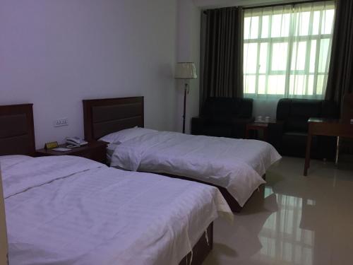 Imagen de la habitación del Casa de Huéspedes Xinye Guest House Jiayuguan. Foto 7