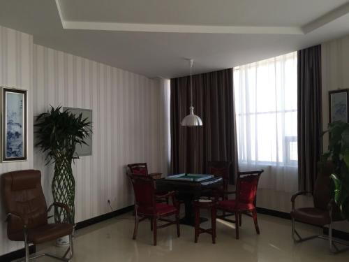 Imagen de la habitación del Casa de Huéspedes Xinye Guest House Jiayuguan. Foto 8