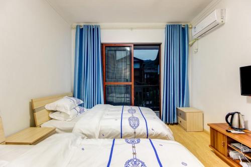 Imagen de la habitación del Casa de Huéspedes Yi Xing Ge. Foto 8