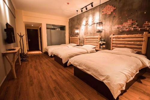 Imagen de la habitación del Casa de Huéspedes Zhangjiajie Interval Time Travel Inn. Foto 6