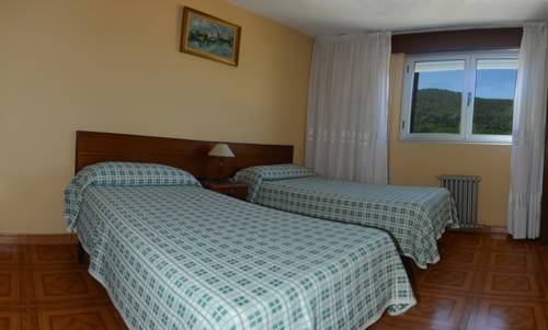 Imagen de la habitación del Hostal Baviera, Pesués. Foto 5