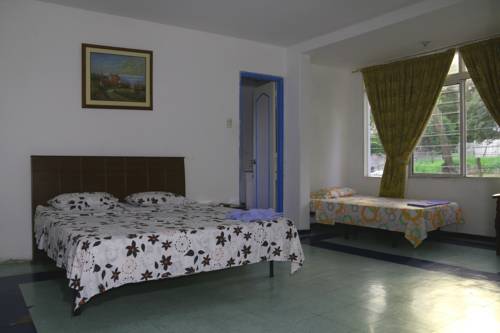 Imagen de la habitación del Hostal Casa Del Gato Cali. Foto 1