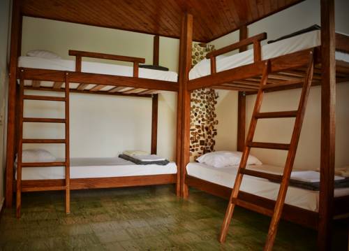 Imagen de la habitación del Hostal Casa Kayam Alojamiento Creativo Y Residencia Artística. Foto 1