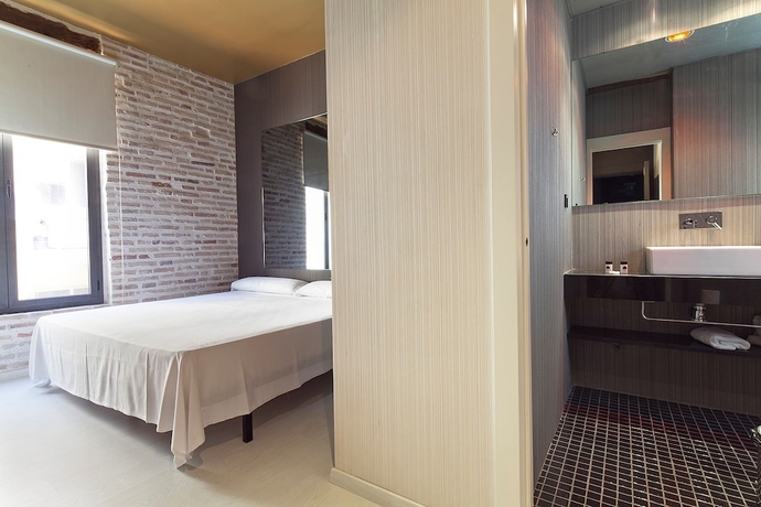 Imagen de la habitación del Hostal Cosy Rooms Embajador. Foto 8