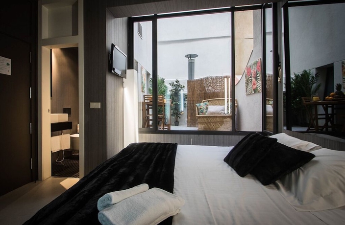 Imagen de la habitación del Hostal Cosy Rooms Embajador. Foto 14