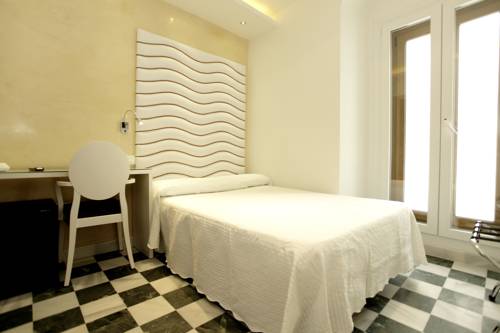 Imagen de la habitación del Hostal El Alojado de Velarde. Foto 8