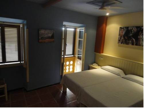 Imagen de la habitación del Hostal Hostal Los Caracoles. Foto 13