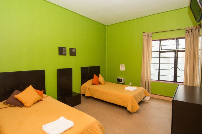 Imagen de la habitación del Hostal Hotel Amigo Suites. Foto 11