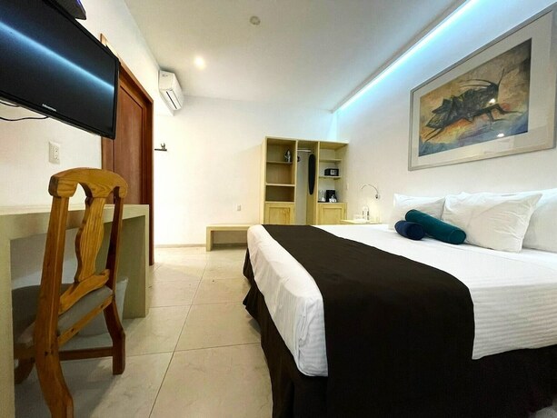 Imagen de la habitación del Hostal Hotel Boutique La Cochinilla. Foto 14