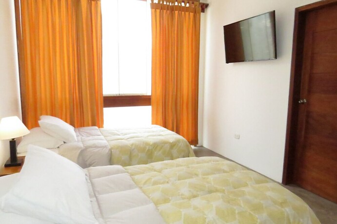 Imagen de la habitación del Hostal Huanchaco. Foto 19